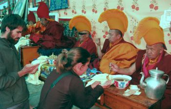 Chris and Amanda receiving blessings from monks