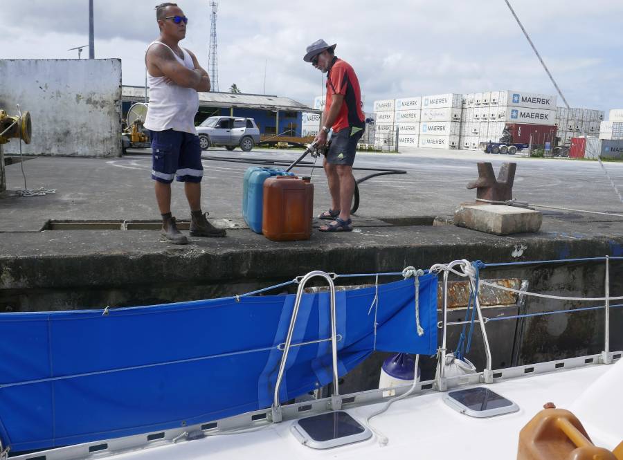 Alfie, with Jon filling diesel jugs at the dock