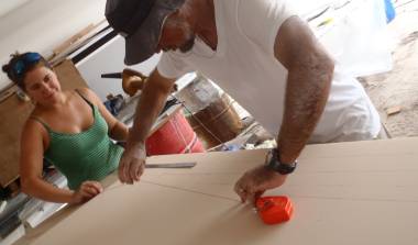 Amanda and Jon laying out cut-lines on the new foam