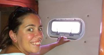 Amanda pulling a headliner (OK, sideliner) out of a cabin