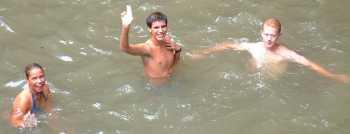 Amanda, Chris, and Kenny swimming under the Annandale Falls