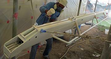 Baw, really getting into spraying the topcoat on the boom