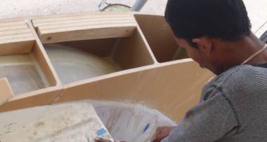 Baw gluing foam blocks into the outside of the starboard wall