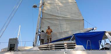 Bruce and Jon installing battens in the mainsail