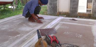 Jack doing final sanding on the top of the bimini