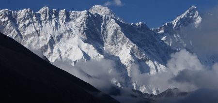 First view of Everest (center) behind Nuptse Ridge