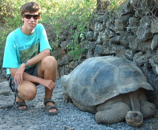 Chris and a Galapago at the Darwin Center