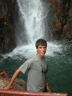 Standing by a waterfall up a river on Viti Levu, Fiji