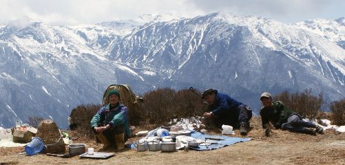 Our cook team relaxes. Lunch is ready on the high traverse above Dzongri