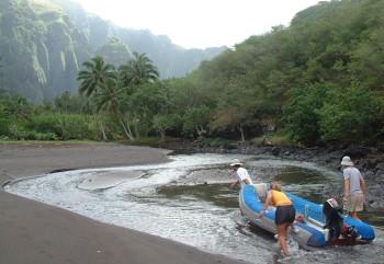 Dragging the dinghy up the river in Daniel's Bay to begin the hike.