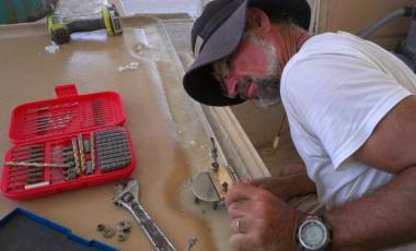 Checking a hinge's fit on a newly cored deck hatch