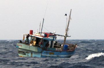 Fishing boat anchored at sea, 300 miles from India