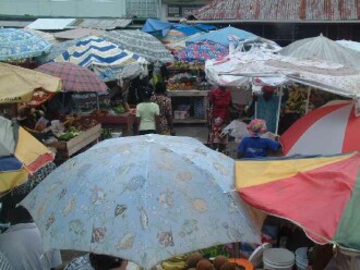 A parade of umbrellas: Open air market in Grenada