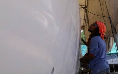 Starboard hull being sanded and starting to show reflections!