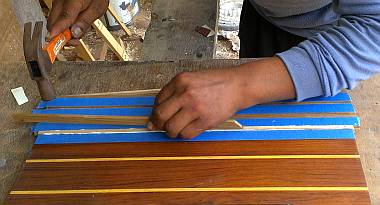 Houa gluing in a strip of ash to replace a strip of holly