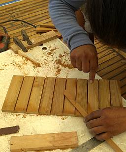 Super-gluing the teak together into a board