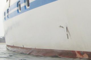 Whale damage to our hull, ~1' or 30cm across