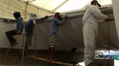 Jack, Lek, Nut and Pla sanding the front of the inner hulls