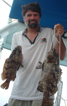 Jon and his two groupers, caught on a hand line