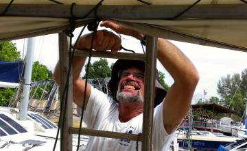 Putting up pulleys to raise the heavy awning to our tent