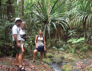Jon, Sue and Amanda pause by a stream in the rainforest near Suva.