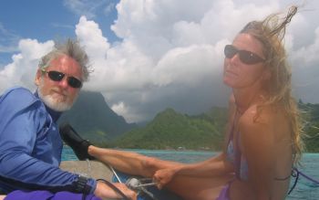 Karen & Jon riding in the dinghy to yet another Moorea dive spot