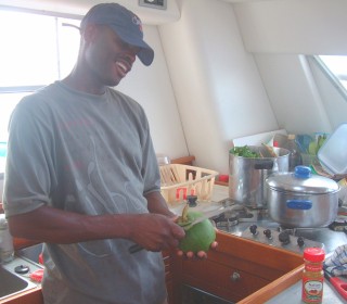 Alexis of Dominica chopping vegies for the land crab stew on Ocelot