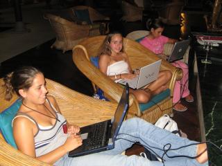 Amanda and Lara enjoying the all-hours 'free' internet access at Rebak.