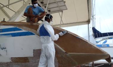 Lek & Baw shaping the foam on the port-side wall