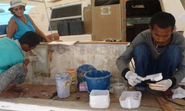 Max laying epoxy glass while Baw glues foam blocks together