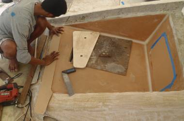 Max fitting another bit of foam to the foredeck