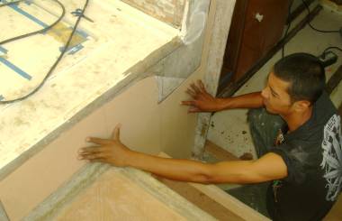 Max fitting a complex sheet of foam near the entryway