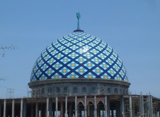 A beautiful tiled dome to top off an otherwise unfinished mosque.