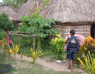 Barefoot school children in a Waya village