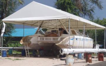 Ocelot under her tent, with her mast on the far side of her