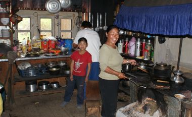 Pema helping cook in the Ringmo guesthouse kitchen