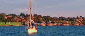 Per Ardua anchored off Tual in evening light