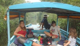 Aboard the klotok in the narrow streams of Borneo