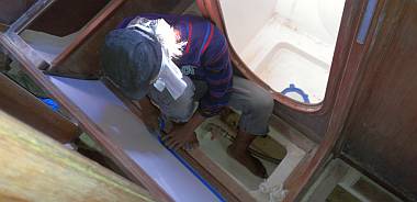 Preparing the starboard cabins for varnish - sanding and masking