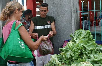 Sue buying fresh produce at the Victoria market