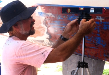 Jon setting up the laser transit to check the waterline