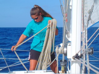 Amanda coils the halyard after shaking the reef