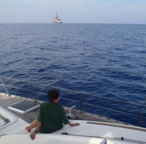 Shantha on the bow. Oil rig offshore India.