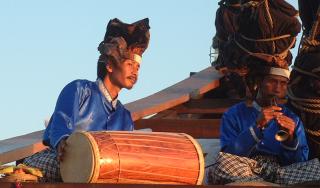 Balinese musicians on a traditional boat