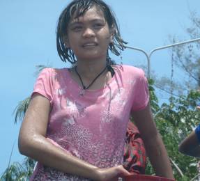 A young, cute, wet Songkran participant!