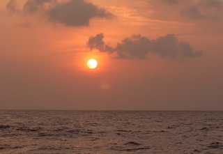 A glorious sunset on a flat sea, en route to Maldives