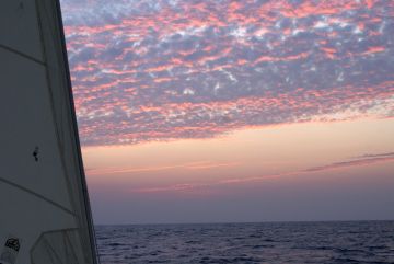 The evening sky lights up above the Bay of Bengal