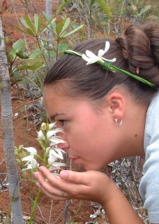 Tianna enjoying the fragrant orchids of New Caledonia