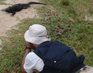 Tony face to face with a marine iguana.