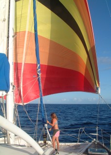 Amanda finishes setting the spinnaker